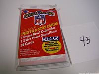 Front of unopened 1989 Pro-Set NFL football trading card pack showing bonus promotion and number of cards inside.
