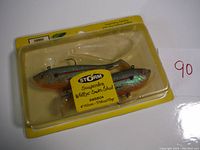 Two Storm Suspending Wildeye Swim Shads lures in original packaging, showing both lures inside clear plastic on yellow backing with label.