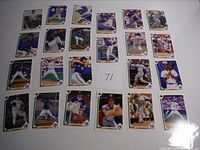 Photo showing 24 vintage Toronto Blue Jays baseball cards arranged on a white surface