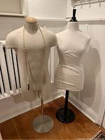 Photo of both male and female dress forms showing materials and bases