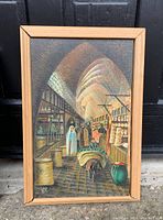 Full front view of framed canvas showing market scene with figures, baskets, and arched ceiling.
