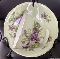 Top view of Ansley teacup on saucer showing floral pattern and gold trim