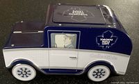 Side view of the Toronto Maple Leafs tin bank van showing detailed graphics, including the driver illustration and logo.