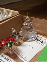 Overview of all three crystal figurines in cardboard box