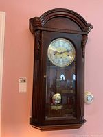 Front view of entire clock on wall