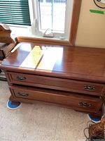 Image of the dresser top and front showing two drawers and scratch on top surface.