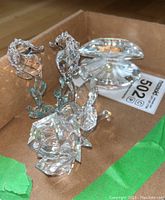 Overall view showing two seahorses, one rose and one clam shell grouped together