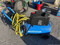 Overall side view showing compressor, hose and blow gun