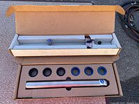 Torque wrench and race setter components laid out in original box