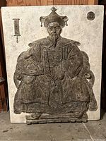 Front view of plaster wall hanging showing detailed relief of Chinese emperor in traditional clothing.