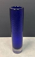 Front view of the tall cobalt blue glass vase showing honeycomb texture and clear thick bottom.