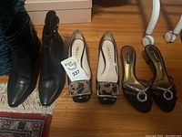 Overview of all three pairs lined up side by side on floor showing front and side profiles