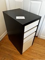 Black IKEA Micke drawer unit angled showing overall condition and shape