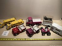 Full view of all assorted Tonka toys in the lot showing placement and condition.