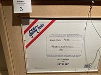 Back of canvas showing artist's name Robert Drummond, painting title 'Woodland Path', dated 1997, on a 12" x 16" canvas.