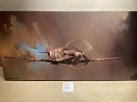 Full front view of framed Spitfire aircraft painting showing clouds and plane detail