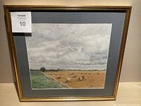 Framed watercolor painting showing the full artwork and frame, highlighting the countryside scene with hay bales.