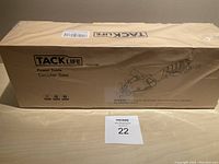 Boxed Tacklife circular saw TCS115E front view showing brand and product type