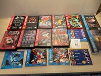 Top view of assorted Sega Genesis cartridge cases and Sega CD longbox cases arranged on table