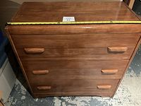 Front view of the wooden dresser with three drawers, showing width measurement tape of approximately 41 inches.