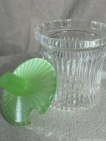 Vintage sugar bowl with clear ribbed crystal glass and green jadeite lid shown separately