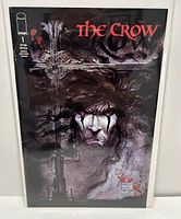 Full front cover of The Crow #1 comic book showing the title and cover art with the character and cross.