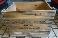 Front side of large wooden crate with company name and locations printed