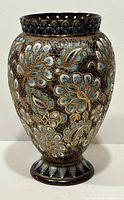 Full front view of the vase showing its shape, size, and floral decoration