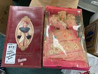 Original boxed Holiday Memories Barbie and Happy Birthday Barbie dolls in their boxes, showing front view with box graphics.