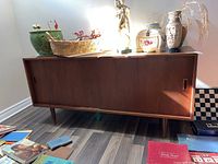 Front view of sideboard with decorative items on top