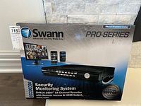 Original retail box for Swann Pro-Series Security Monitoring System DVR16-2600 with images and branding.