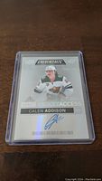 Calen Addison rookie hockey card with autograph in protective plastic case