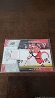 Front of Eric Staal hockey card with white jersey swatch embedded on the card.