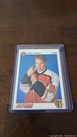 Photo of a Peter Forsberg rookie hockey card in a protective plastic sleeve.