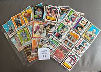 Lot of 40 OPC hockey cards spread on surface including various year and star players.