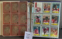 Binder pages with multiple football cards displayed, including San Francisco 49ers players in red jerseys.