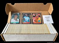 Box containing a complete set of 1987 Donruss baseball cards, organized and stacked.