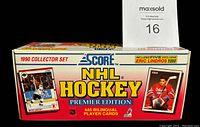 Closed original box of 1990 Score NHL Hockey Premier Edition set, highlighting 445 bilingual player cards and five exclusive Eric Lindros cards.