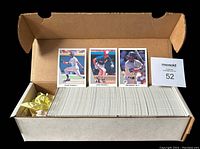Open box with the full set of 1990 Leaf baseball cards in white-bordered sleeves, three cards on display (Frank Thomas, Larry Walker, Ken Griffey Jr.), plus a number card with 52.