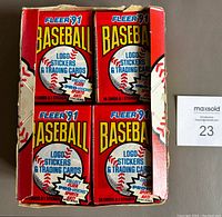Top view of the wax box showing multiple unopened packs and partial damage to the box lid.