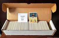 Opened box of 1993 Bowman Baseball Cards showing full set in row, with Derek Jeter rookie card and lot identifier card.