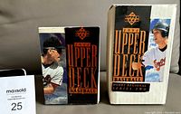 Two Original Upper Deck 1994 Baseball boxes placed upright showing front graphics featuring baseball players and branding.