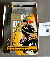 Partial wax box of 1995-96 Leaf Hockey cards featuring Mario Lemieux on box front. Box shows some handling wear.
