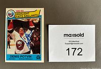 Front of Denis Potvin 1982-83 O-Pee-Chee hockey card showing player image and blue Sharpie autograph, alongside MaxSold lot card numbered 172.