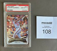 Front view of the 1998 Topps Finest Vladimir Guerrero baseball card graded PSA Gem Mint 10 in clear hard plastic case with label.