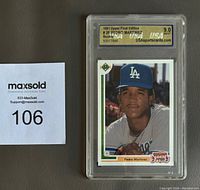 Front of the Pedro Martinez baseball card in protective slab showing grade 9 Mint by USA Sports Cards.