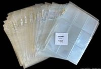 Stack of clear, flexible Ultra Pro Platinum 9-card pages showing multiple pages in a pile.