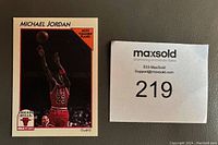 Front of Michael Jordan 1991-92 Hoops basketball card #5 showing photo of Jordan in red Chicago Bulls uniform shooting ball, labeled "Most Valuable Player."