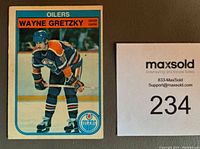 Front of the Wayne Gretzky 1982-83 O.P.C. hockey card #106 showing player in Oilers uniform on the ice.