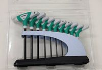 Photo of 10 piece T-handle Torx key set in black holder in original plastic packaging. Green and white handles visible, sizes from T8 to T60.